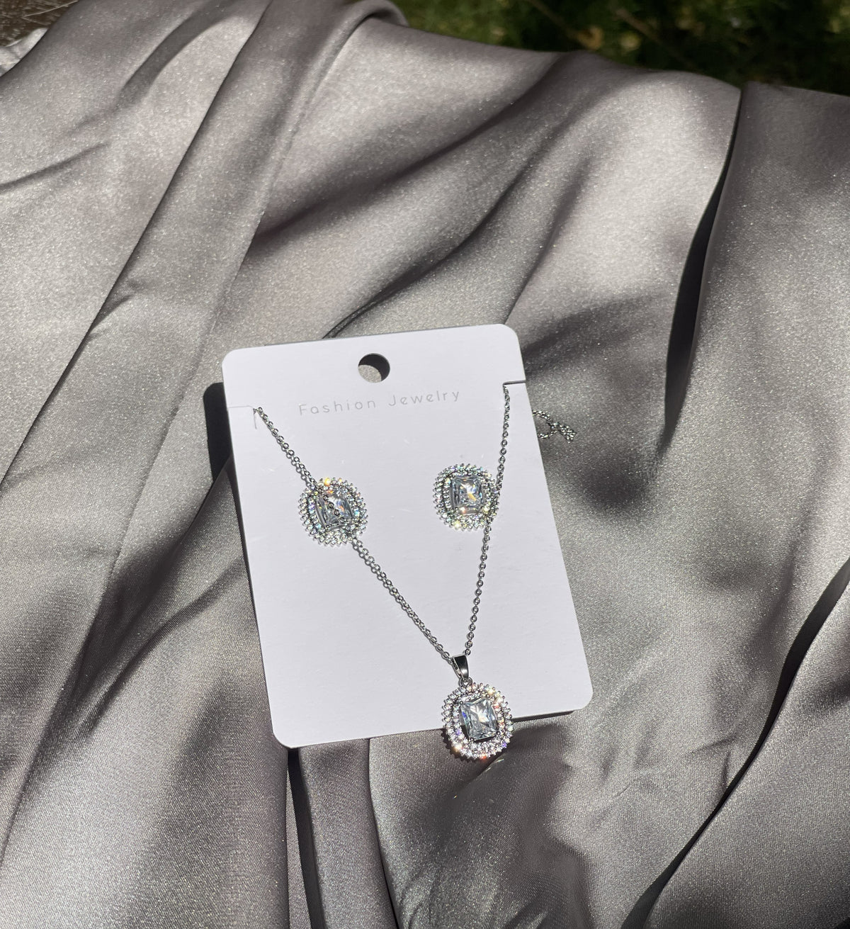 The Grand Emerald-Cut Halo Set